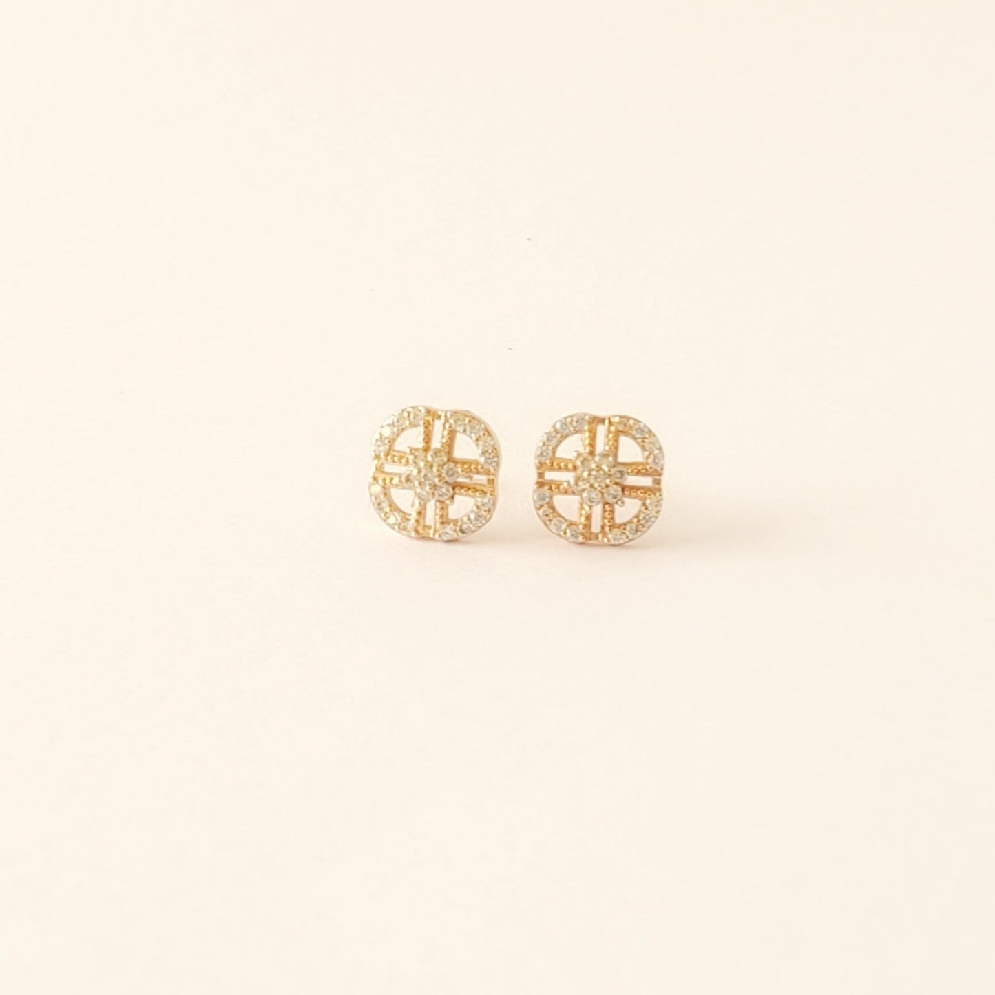 rounded square cubic zirconia earrings with a centre cross 