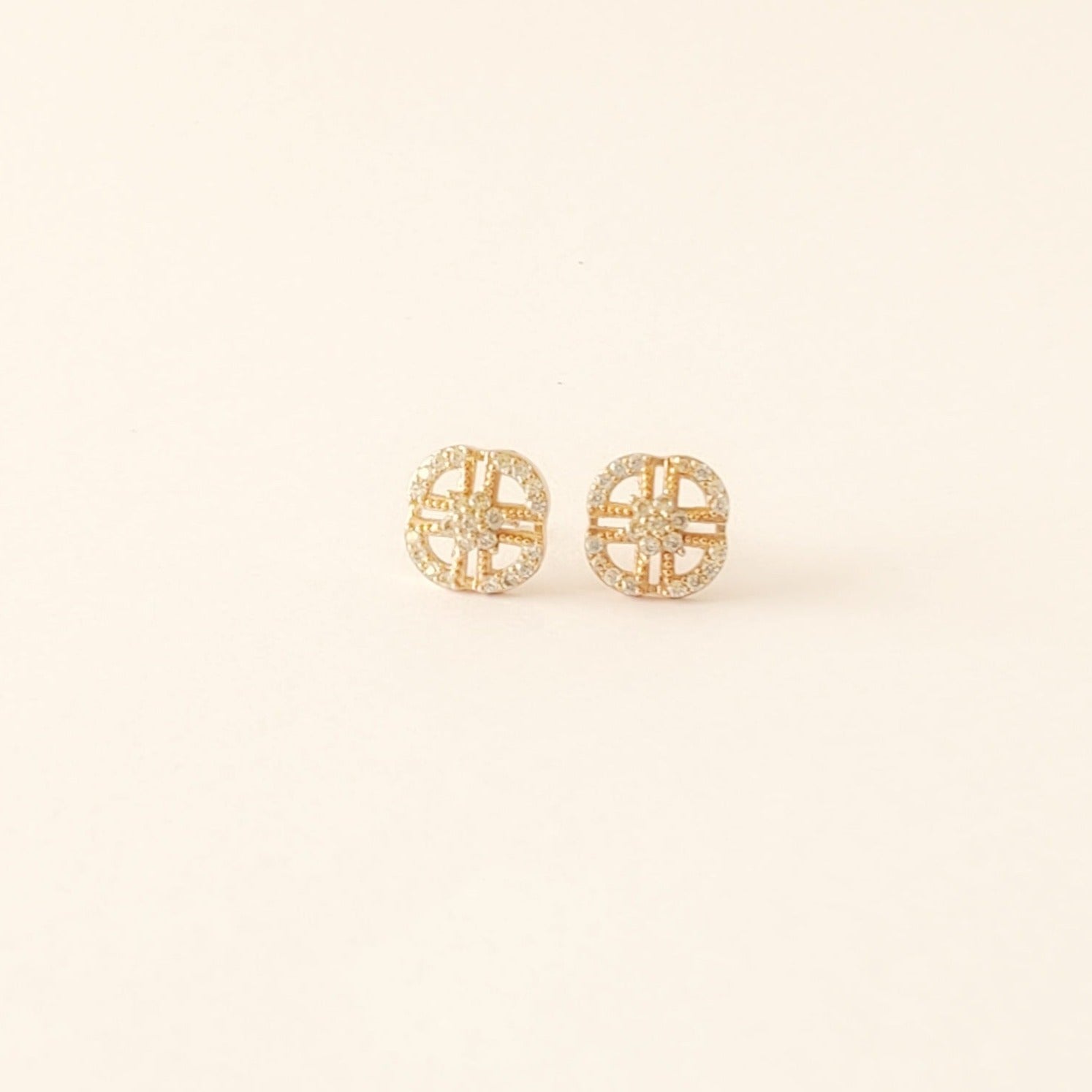 rounded square cubic zirconia earrings with a centre cross 